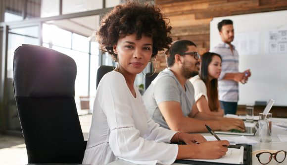 confident-businesswoman-sitting-at-a-business-PPDZBVF.jpg