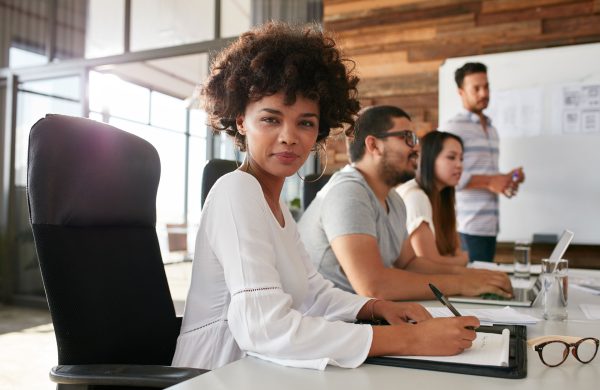 confident-businesswoman-sitting-at-a-business-PPDZBVF.jpg