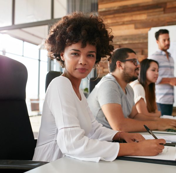 confident-businesswoman-sitting-at-a-business-PPDZBVF.jpg