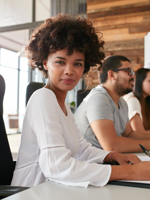 confident-businesswoman-sitting-at-a-business-PPDZBVF.jpg