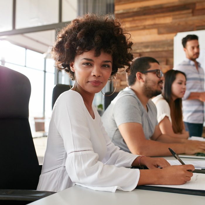 confident-businesswoman-sitting-at-a-business-PPDZBVF.jpg